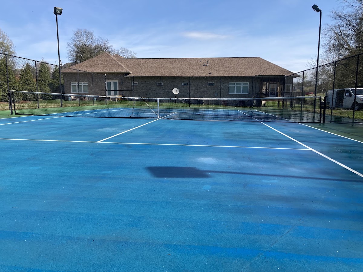 Freshly cleaned blue tennis court