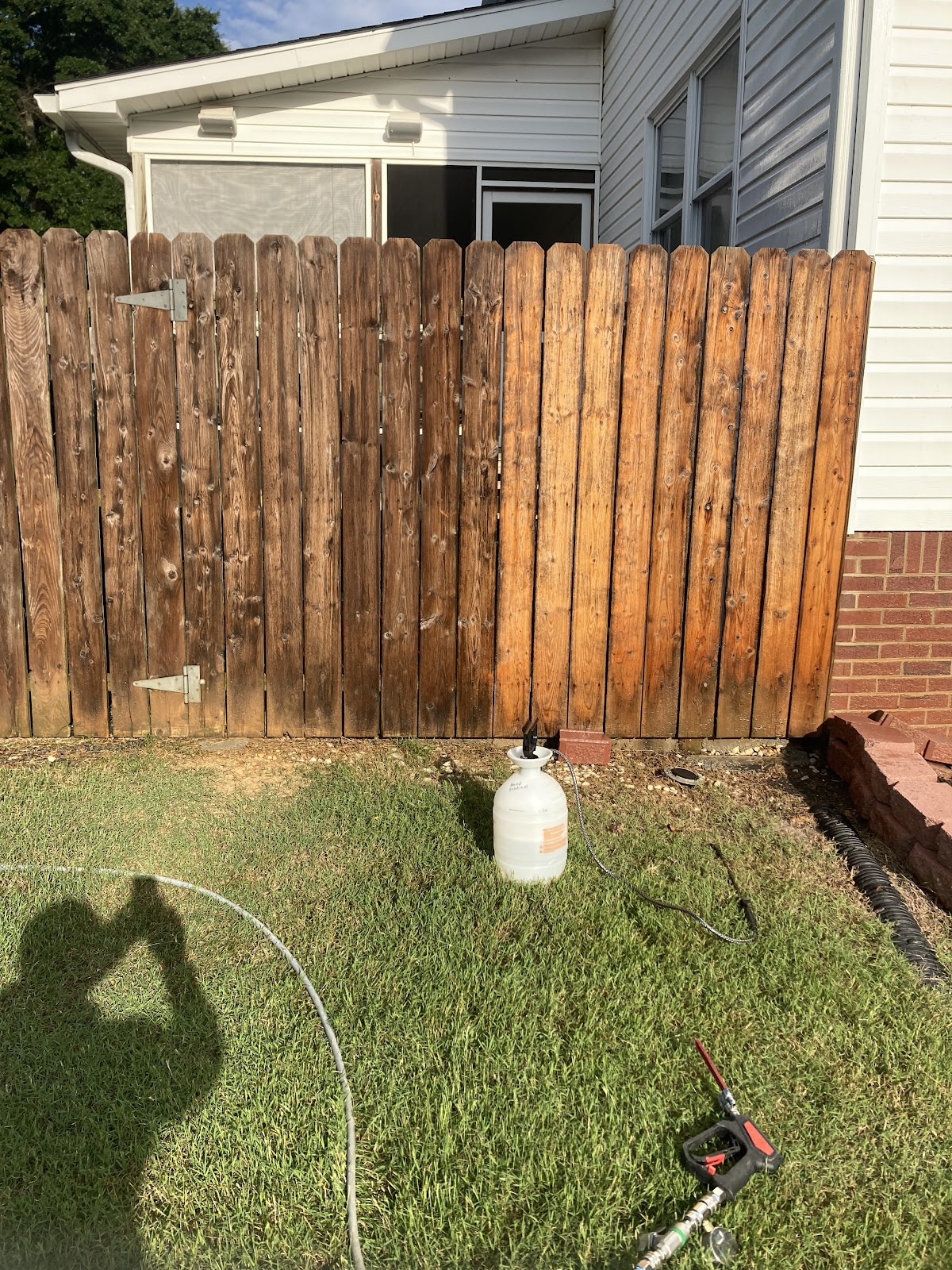 Wooden privacy fence after pressure washing