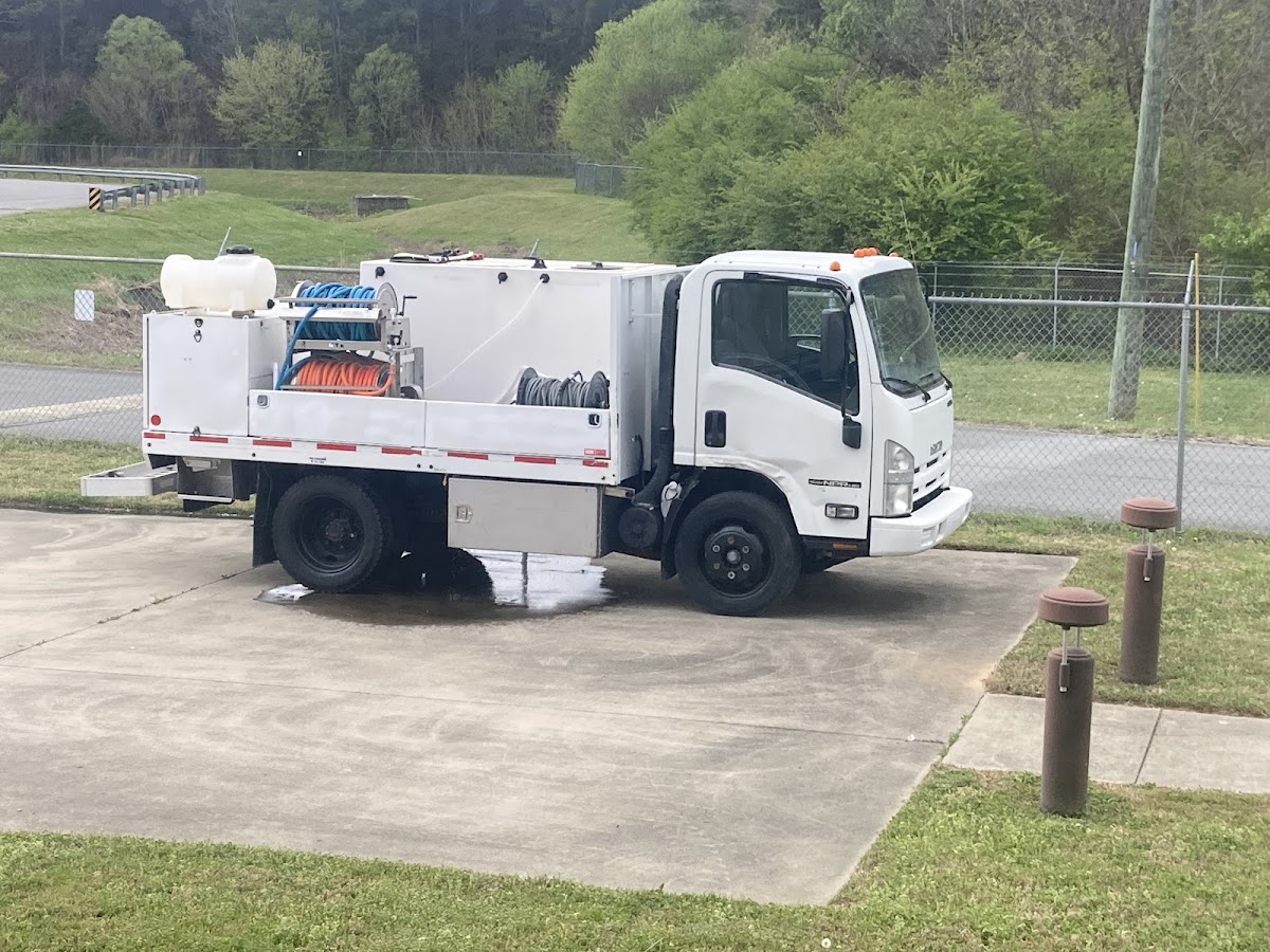 A&J white box truck wash rig parked on a job